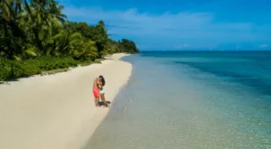 A couple enjoying a moment on a secluded Fiji beach